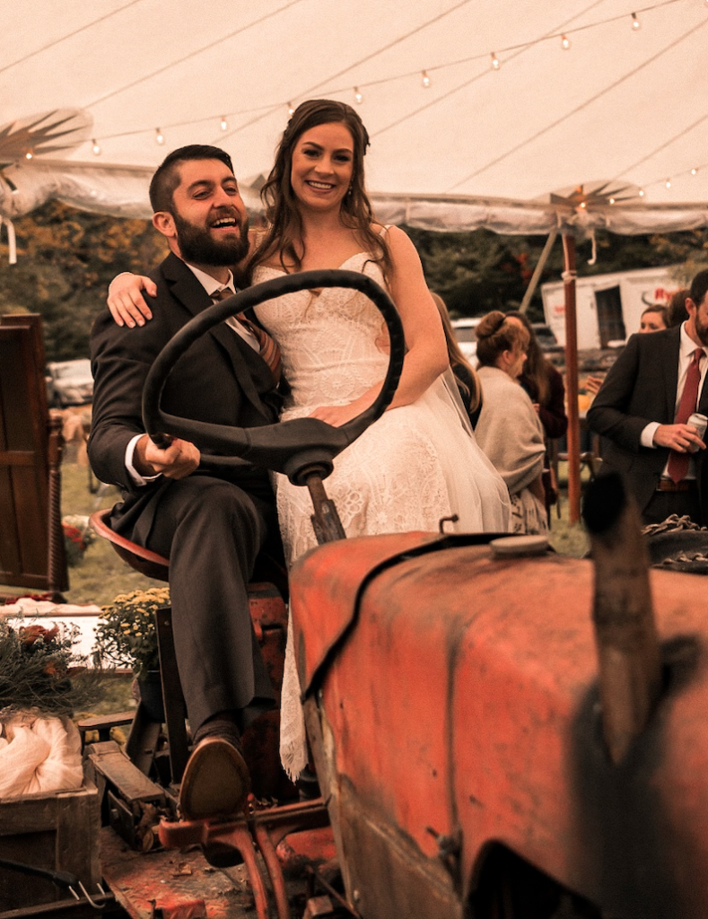 Bride and Groom sitting on tractor