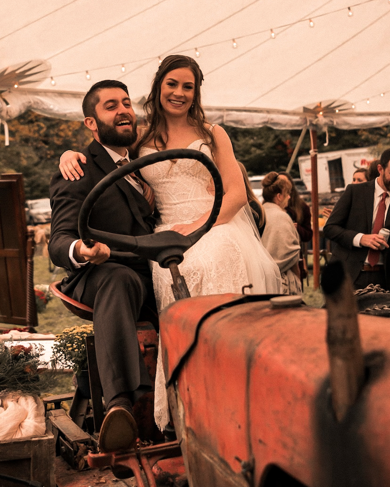 Bride and Groom sitting on tractor